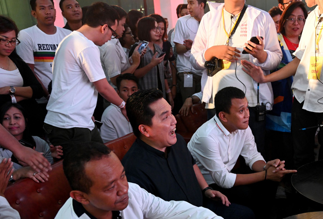 Erick Thohir (centre), campaign manager for Indonesian President Joko Widodo's reelection, celebrates with his team in Jakarta on Sunday (AFP photo)