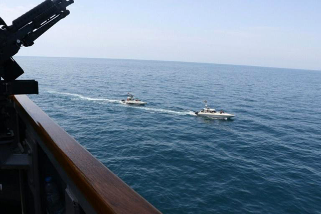  US navy file photo taken on April 15 shows Iranian Islamic Revolutionary Guard Corps Navy vessels near the guided-missile destroyer USS Paul Hamilton in the Gulf (AFP photo)