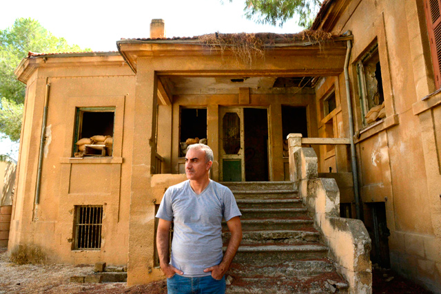 Iranian singer Omid Tootian, 46, poses for a picture during an interview in the UN-controlled buffer zone in the Cypriot capital Nicosia, on Wednesday, where he has been stuck since mid-September (AFP photo)