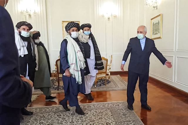 A photo obtained by AFP from the Iranian news agency Tasnim on Sunday, shows Iran’ Foreign Minister Mohammad Javad Zarif (right), meeting with Mullah Abdul Ghani Baradar (centre) of the Taliban in Tehran (AFP photo)