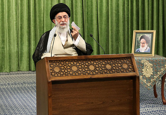 This handout photo provided by the office of Iran's Supreme Leader Ayatollah Ali Khamenei on Thursday shows him addressing parliament members during an online meeting in the Iranian capital Tehran, with a picture of his predecessor, the late Ayatollah Ruhollah Khomieni next to him (AFP photo)