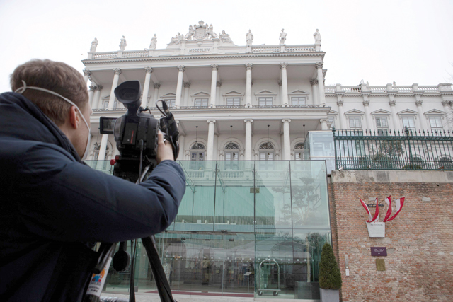 This file photo taken on February 8 shows a cameraman filming the Hotel Palais Coburg in Vienna, venue of diplomatic talks on Iran’s nuclear programme (AFP photo)
