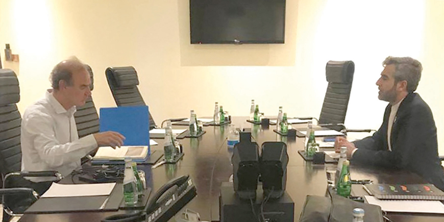 This handout photo provided by the Iranian news agency IRNA on Tuesday shows Iran's chief nuclear negotiator Ali Bagheri Kani( right) meeting with the European Union's nuclear talks coordinator Enrique Mora in Qatar's capital Doha (AFP photo)