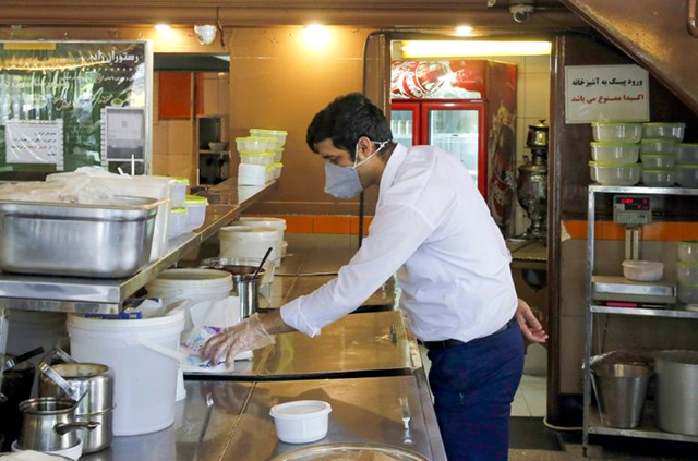 A restaurant employee waits for customers in the Iranian capital Tehran (AFP photo)