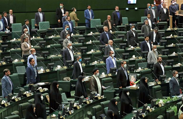 For the opening session of Iran's new parliament, a seat was left vacant between each lawmaker in accordance with social distancing guidelines (AFP photo)