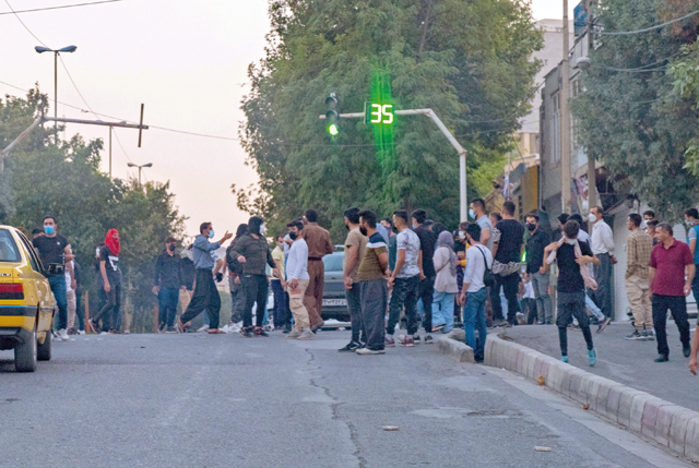 Iranians protest in Sanandaj, the capital of Iran's Kurdistan province, on Monday following the controversial death of a young Kurdish woman while in custody by the ‘morality police’, which enforces strict dress codes  (AFP photo)