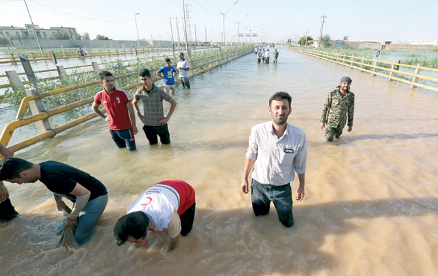 Barricades are set up to contain water in a flooded street, in the city of Ahvaz, the capital of Iran's Khuzestan province, on Wednesday (AFP photo)