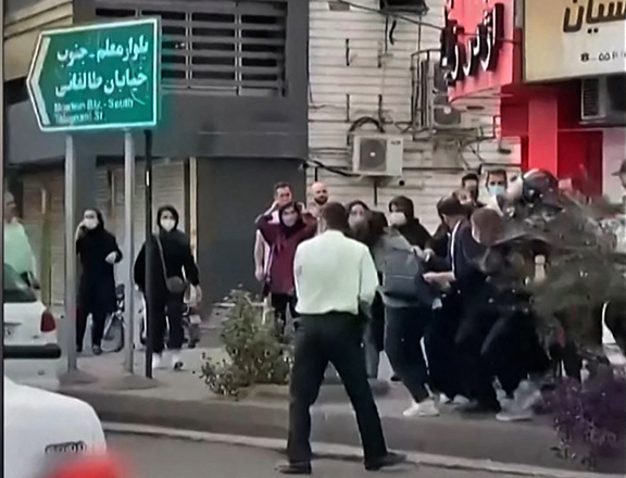 This image grab from a UGC video made available on Wednesday shows female protesters being roughly handled by Iranian security forces in the city of Rasht, in Iran's northern Gilan province (AFP photo)