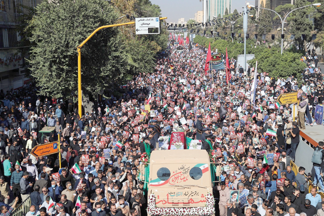Mourners take part in a funeral for victims of a mass shooting at a key shrine earlier in the week that killed more than a dozen worshippers, in Iran's southern city of Shiraz, on Saturday (AFP photo)
