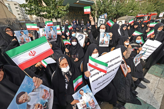 Women protesters gather for an anti-German demonstration, condemning Germany's support of Berlin-based Iranian opposition TV stations and anti-government protests in Iran, outside the German embassy headquarters in Iran's capital Tehran on Tuesday (AFP photo)