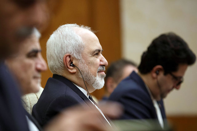 Iranian Foreign Minister Mohammad Javad Zarif (centre) meets Chinese Foreign Minister Wang Yi (not photographed) at Diaoyutai State Guesthouse in Beijing, China, on Friday (Reuters photo)
