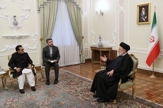 This handout photo taken and released by the Iranian Presidency shows Iran's President Ebrahim Raisi (right) meeting with Pakistan's new ambassador Muhammad Mudassir Tipu in Tehran on Saturday (AFP photo)