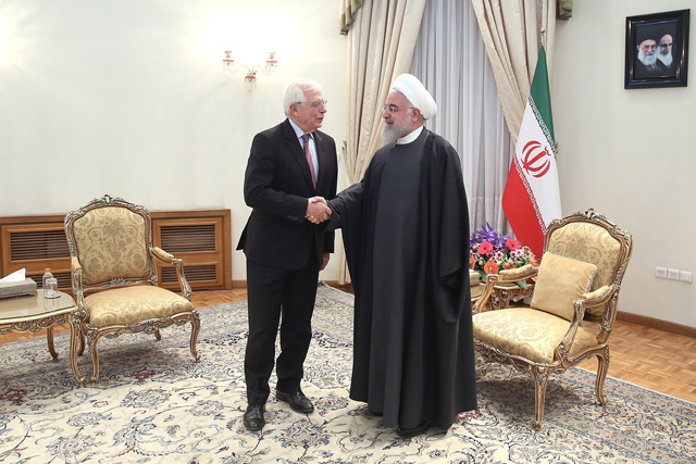 This handout photo provided by the Iranian presidency shows President Hassan Rouhani welcoming Josep Borrell (left), European Union high representative for foreign affairs and security policy and vice president of the European Commission, on Monday in Tehran (AFP photo)