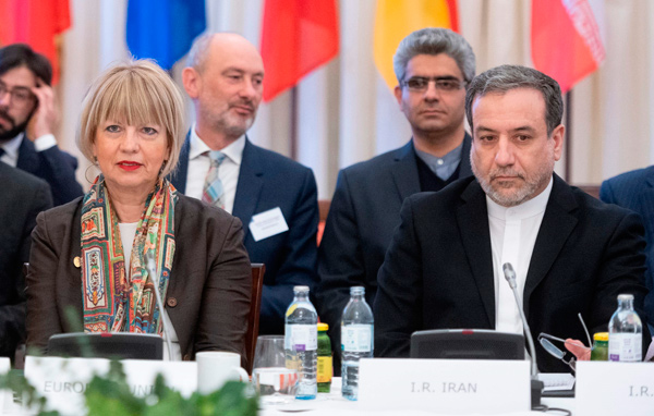 Abbas Araghchi (right), political deputy at the ministry of foreign affairs of Iran, and the Secretary General of the European Union External Action Service Helga Schmid attend a Meeting of the JCPOA Joint Commission on Iran's nuclear programme at the EU Delegation to the International Organisations office in Vienna, Austria, on Wednesday (AFP photo)