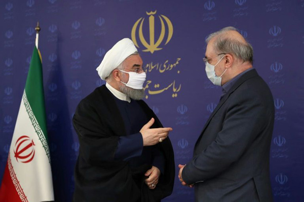 Iran's President Hassan Rouhani (left) has started wearing a mask in public as novel coronavirus cases have mounted (AFP photo)