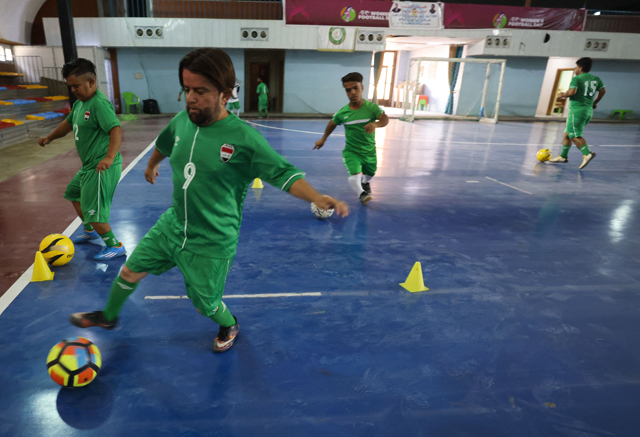 Members of the Iraqi football team for little people attend a training session at a fitness centre in the capital Baghdad on October 5 in preparation for international competitions (AFP photo)