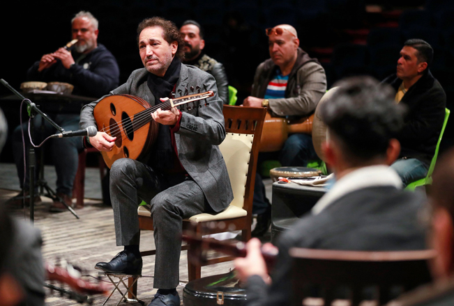 Iraqi musician Naseer Shamma plays the oud during rehearsals at the Iraqi National Theatre in Baghdad on Monday (AFP photo)