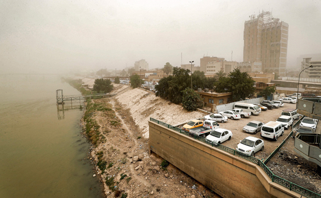 This photo taken on Wednesday shows a view of the left bank (eastern) of the Tigris River from the Sinek Bridge (unseen) in Iraq’s capital Baghdad during a severe dust storm (AFP photo)