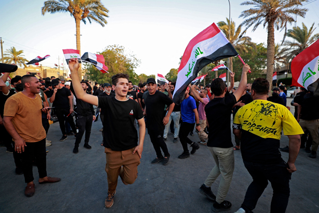 Supporters of Iraq's Coordination Framework gather during a sit-in on a bridge leading to the capital Baghdad's high-security Green Zone, on Monday (AFP photo)