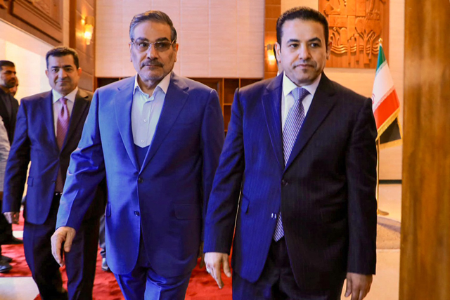 In this handout photo released by Iraq's National Security press office, Iraq's National Security Adviser Qasim Al Araji (right) meets with the Secretary of Iran's Supreme National Security Council Ali Shamkhani  in Baghdad on Sunday (AFP photo)