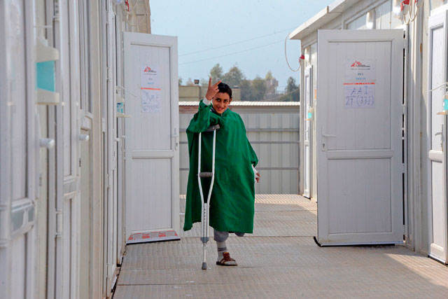 A young patient gestures as he walks on crutches at the Doctors Without Borders hospital in Iraq's Mosul, on January 30 (AFP photo)