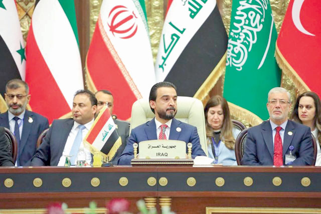 This handout photo released by the Iraqi Parliament's press office shows Iraq's Parliament Speaker Mohammed Al Halbousi (centre) attending the Baghdad summit for Parliaments of Iraq Neighbouring Countries, in the capital Baghdad, on Saturday (AFP photo)