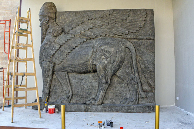 This photo taken on Wednesday shows a replica of a ‘Iamassu’, an Assyrian protective deity depicted with a human head, the body of a lion, and bird wings, being prepared for unveiling at the University of Mosul in the northern Iraqi city (AFP photo) 