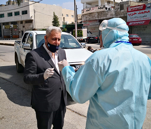 A total of 250 samples were taken from the contacts of an Irbid truck driver and employees at various stores in his area of residence to be tested for COVID-19 (Petra photo)