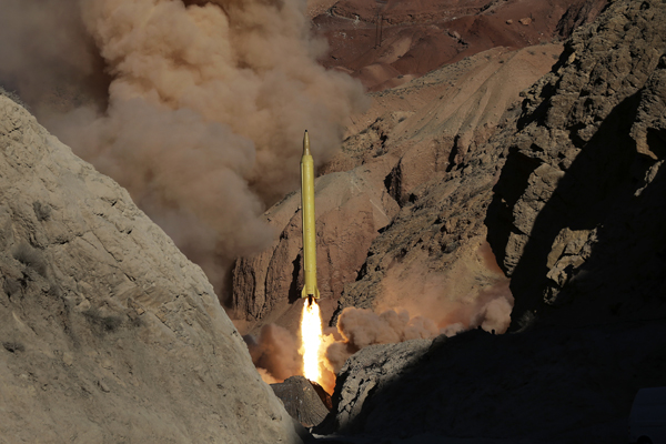 In this photo obtained from the Iranian Fars News Agency, a Qadr long-range ballistic surface-to-surface missile is fired by Iran’s Revolutionary Guard, during a manoeuvre, in an undisclosed location in Iran, Wednesday (AP photo)