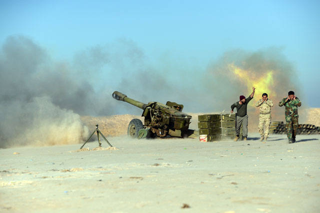 Popular Mobilisation Forces fire towards Daesh positions during a battle with the militants, west of Mosul,Iraq, on Monday (Reuters photo)