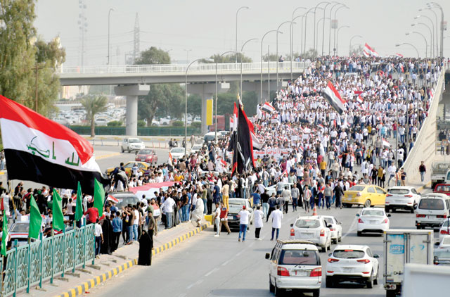 Iraqi students take part in anti-government demonstrations in the central holy city of Najaf on Wednesday (AFP photo)