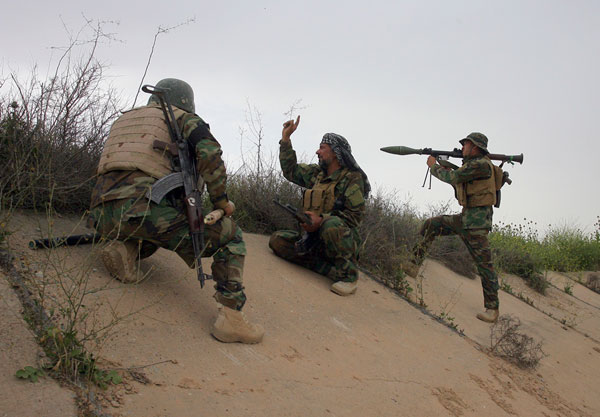 Iraqi security forces and allied popular mobilisation forces take combat positions during a military operation to regain control of the Daesh terror group held town of Besher outside the oil-rich city of Kirkuk,  290 kilometres north of Baghdad, Iraq, on Sunday (AP photo)