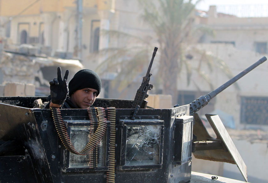 A member of Iraq’s elite counterterrorism service flashes the ‘V’ for victory sign on Wednesday in the city of Ramadi, the capital of Iraq’s Anbar province, about 110 kilometres west of Baghdad (AFP photo)