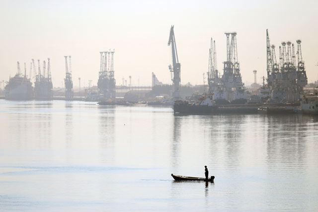 A Iraqi fisherman stands on his boat on the Shatt Al Arab waterway in the southern city of Basra, some 600km from the capital Baghdad, on Friday (AFP photo)