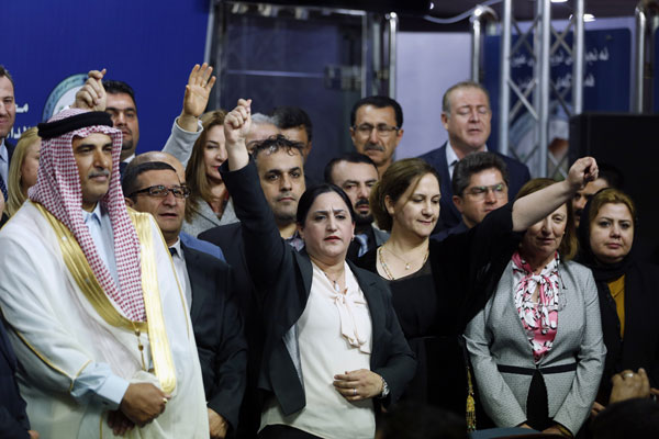 Iraqi lawmakers who attempted to oust the speaker of parliament gather during a news conference in Baghdad, Iraq, Thursday (AP photo)