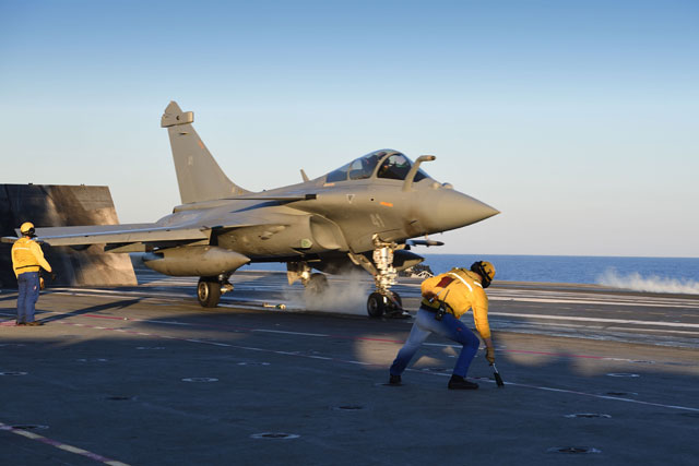 A Marine Rafale fighter jet is catapulted from the French aircraft carrier Charles de Gaulle on the Mediterranean Sea on Saturday as part of the Operation Arromanches III (AFP photo)