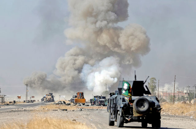 IED planted by Daesh militants explodes in front of Iraqi special forces vehicles in Bartella, east of Mosul, Iraq, on Thursday (Reuters photo)