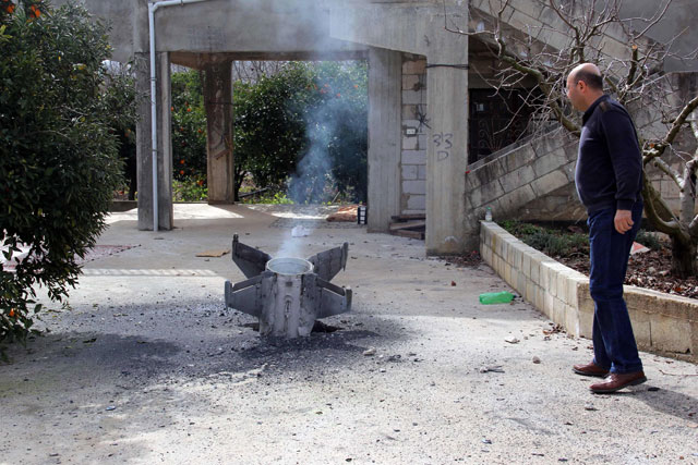 This photo taken on Saturday, shows the remains of a missile that landed in the southern Lebanese village of Kaoukaba, near the border with Syria, after Israel's military attacked 12 Syrian and Iranian targets inside Syria in what it described as ‘large-scale’ raids following an exchange of fire earlier in the day (AFP photo)