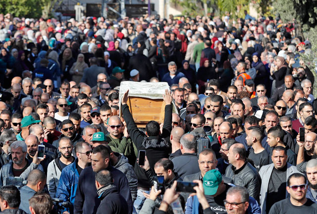 Mourners carry the coffin of Arab-Israeli student Aya Maasarwe during her funeral in the Arab-Israeli town of Baqa Al Gharbiyye, on Wednesday (AFP photo)