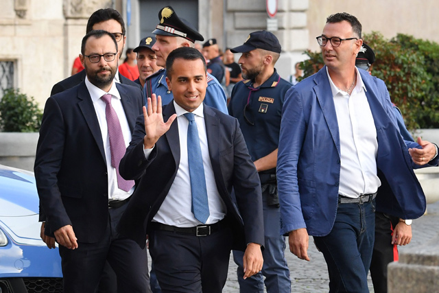 Head of the M5S Five Star start political movement, outgoing Italy’s Labour and Industry Minister and Deputy PM Luigi Di Maio (centre) waves as he arrives along with Head of Senate M5S Five Star movement parliamentary group Stefano Patuanelli (left) for a meeting with the Italian president as part of a second round of consultations with political parties at the Quirinal presidential palace in Rome, on August 28 (AFP photo)