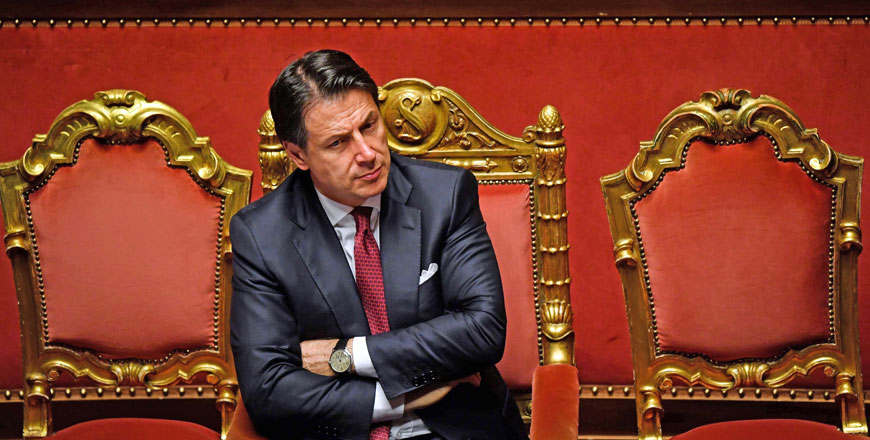 Italian Prime Minister Giuseppe Conte reacts after delivering a speech at the Italian senate, in Rome, on Tuesday (AFP photo)