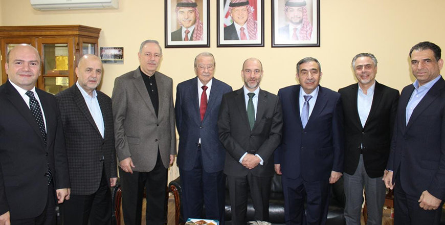 Members of the Jordanian Businessmen Association and Belgian Ambassador Serge Dickschenon pose for a photo during a meeting on Tuesday (Petra photo)