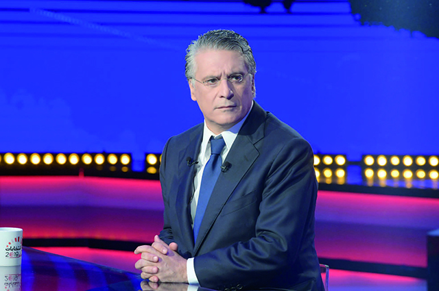In this file photo taken on October 11, 2019 Tunisia’s business tycoon Nabil Karoui, 56, attends a debate against Kais Saied (unseen) before the second round of the presidential elections in Tunis (AFP photo)