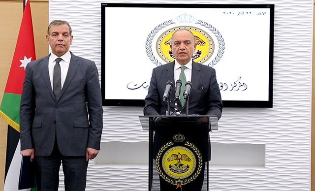 Minister of State for Media Affairs Amjad Adaileh speaks during a joint press briefing with Health Minister Saad Jaber at the National Centre for Security and Crisis Management on Sunday (Petra photo)