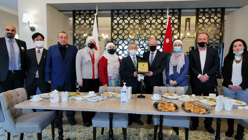 Japan’s Ambassador to Jordan Shimazaki Kaoru poses for a group photo during the handover ceremony of kitchen equipment to the Circassian Charity Association’s women’s branch in Amman on Thursday (Photo courtesy of Japanese embassy)