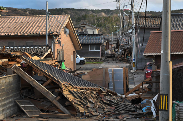 Collapsed wooden houses are seen in Wajima, Ishikawa prefecture on Tuesday, a day after a major 7.5 magnitude earthquake struck the Noto region (AFP photo)