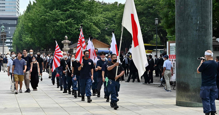 Members of right-wing organisations gather at the entrance to Yasukuni Shrine in Tokyo on Monday, to mark the 77th anniversary of Japan’s surrender in World War II in 1945  (AFP photo)