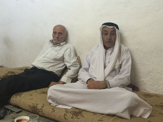 Bishara Zoumot (left) and Daoud Adwan speak to The Jordan Times in a recent interview in their hometown of Shuneh in the Jordan Valley (Photo by Dana Al Emam)