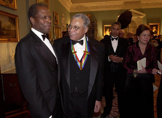 Kennedy Centre honoree actor James Earl Jones (right) speaks with actor Sidney Poitier at the Kennedy Centre Honours Gala at the US State Department in Washington, DC (AFP photo)
