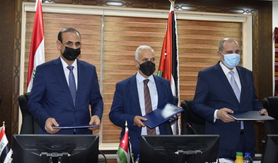 From left: Iraqi Minister of Labour and Social Affairs Adel Rikabi, Minister of Social Development Ayman Mufleh and Minister of Labour Yousef Al Shamali during the signing ceremony of two agreements between Jordan and Iraq on Thursday (Petra photo)